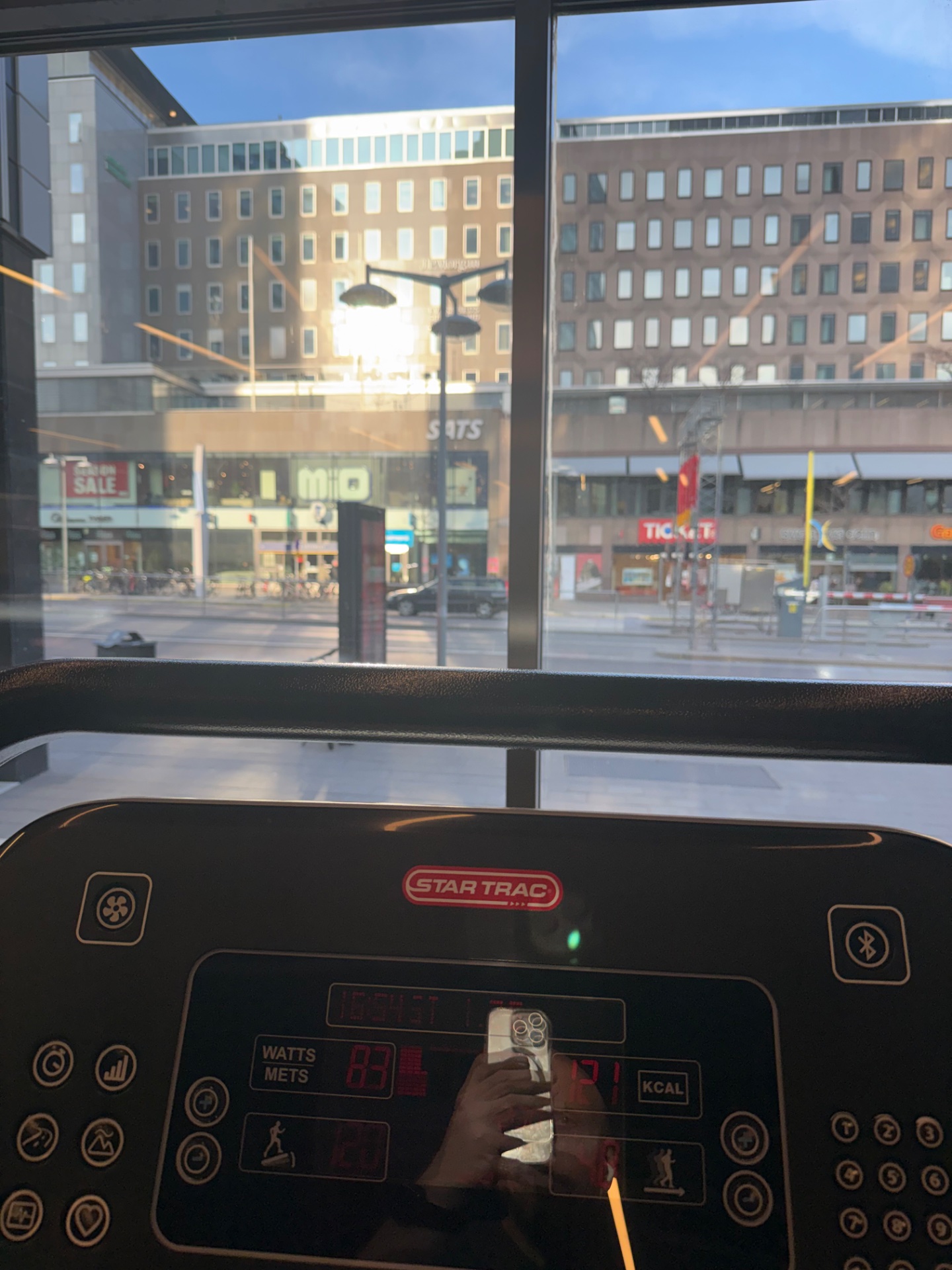 Treadmill workout session captured on a Star Trac machine with a view of the urban street below. Great cardio session tracking watts, mets, and calories burned!