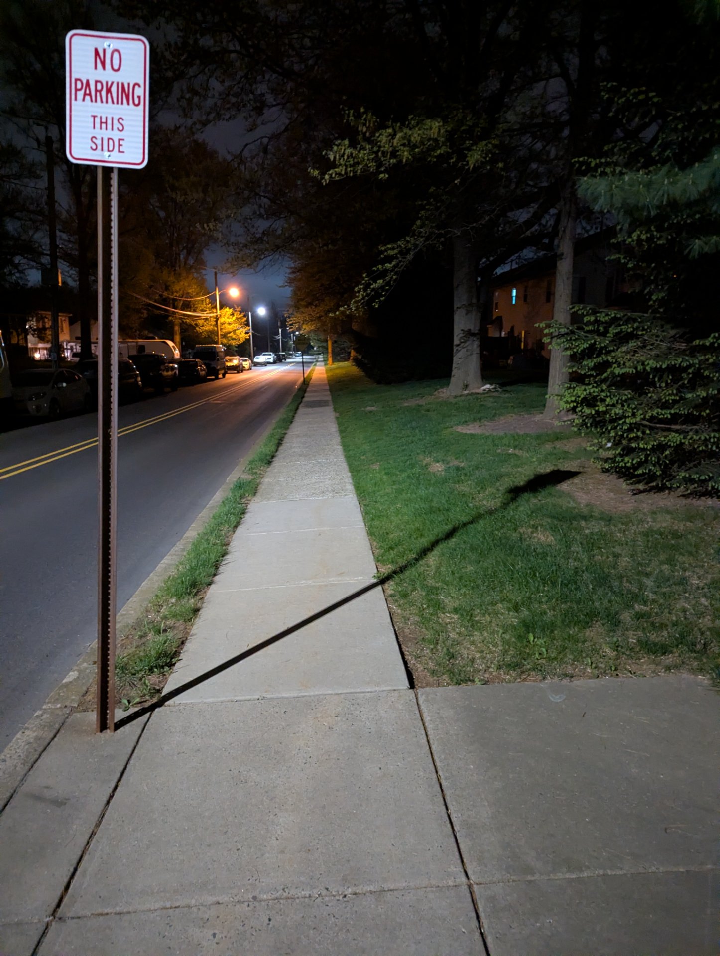 An evening walk or run down a peaceful residential street with sidewalks and tree-lined paths—a great low-key cardio session in a safe, well-lit neighborhood!