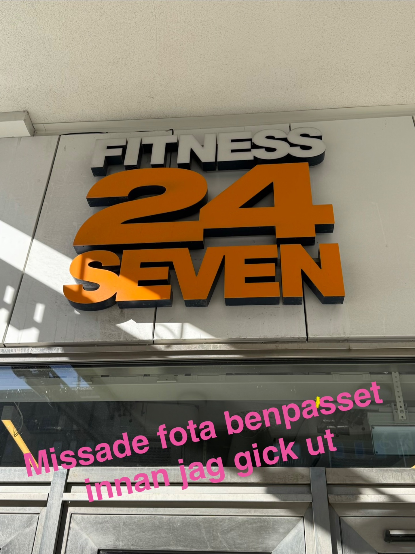 A photo of the Fitness24Seven gym storefront sign, a 24-hour fitness facility. While this shows a gym location rather than an active workout, it represents access to both cardio and strength training equipment.