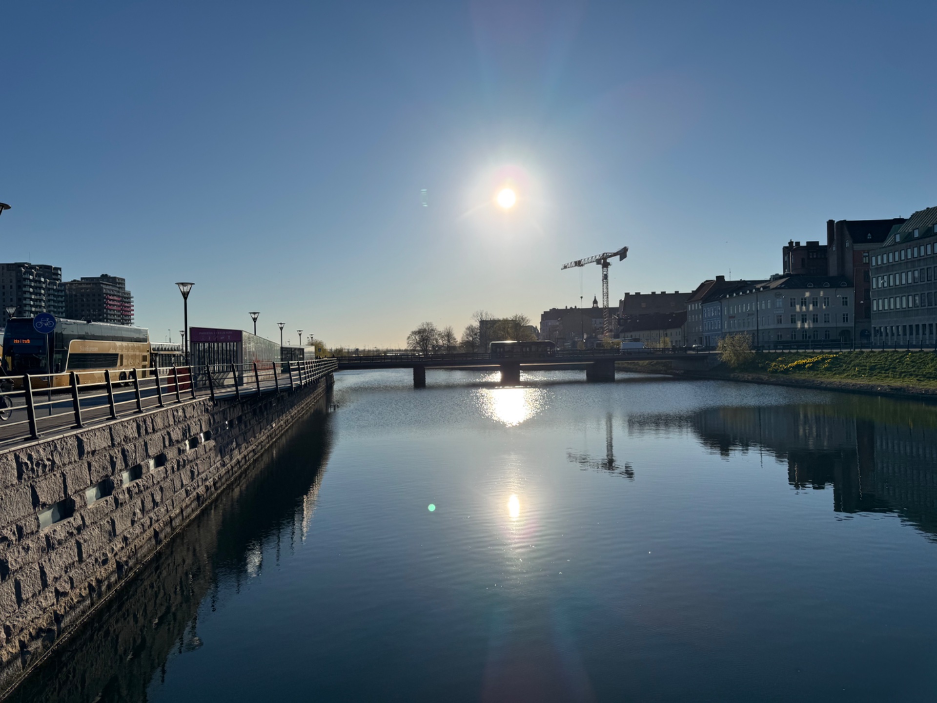 A scenic waterfront walk or run along a beautiful canal or river path with urban architecture in the background. Perfect for outdoor cardio exercise in a picturesque setting!