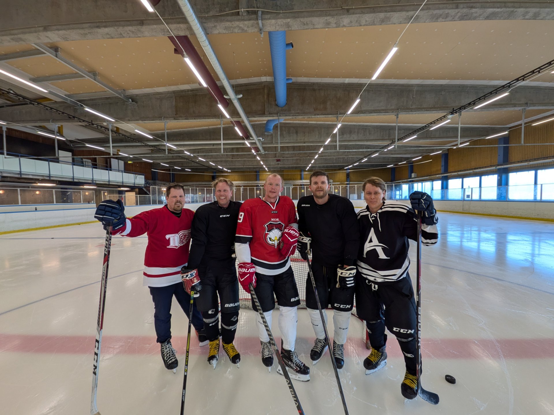 A fun recreational ice hockey game with a group of players on the rink! Ice hockey is an excellent full-body cardio workout that builds endurance, speed, and agility.