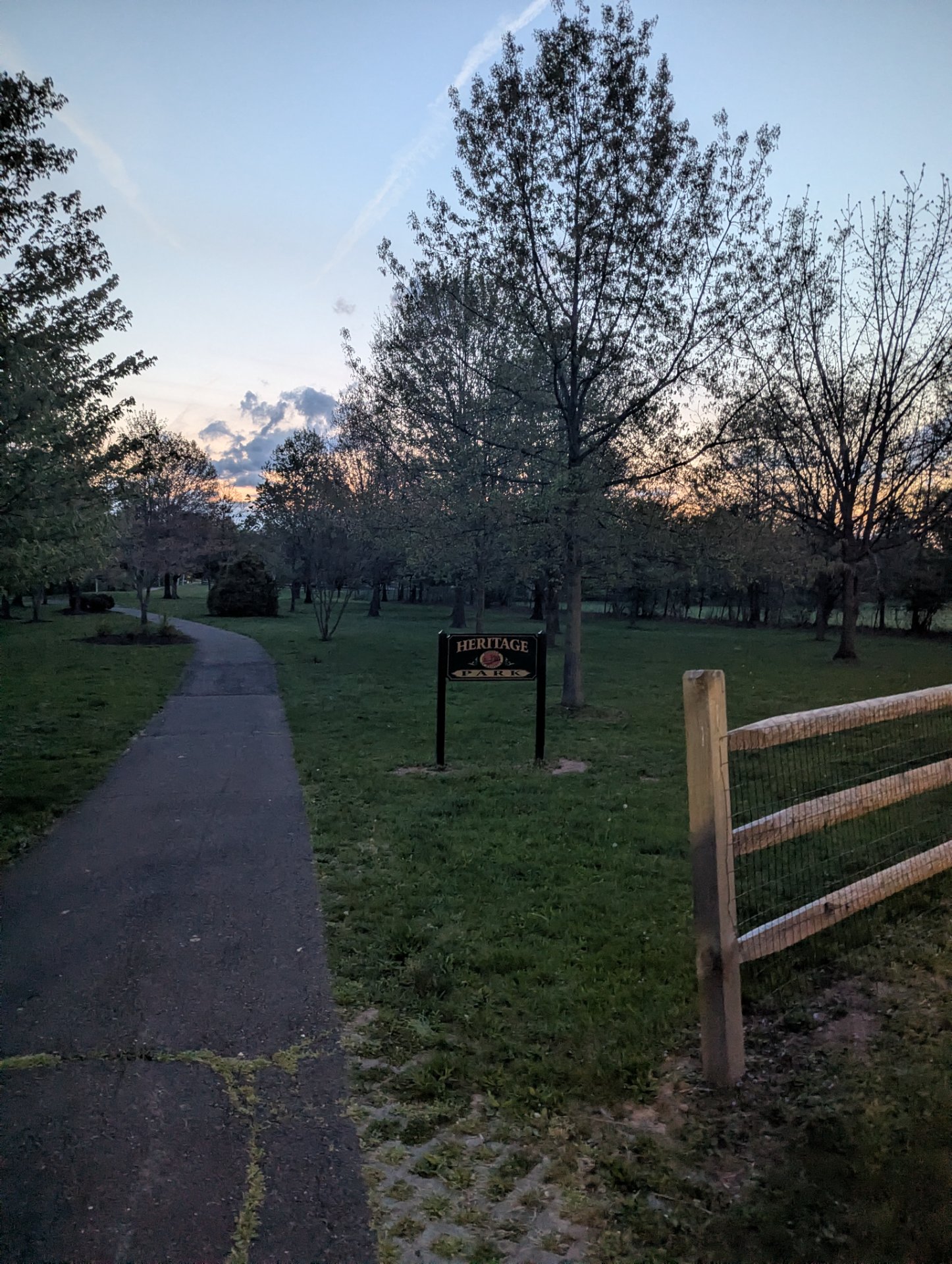 A scenic evening walk or run through Heritage Park on a beautiful tree-lined path. Perfect outdoor cardio activity with natural surroundings and fresh air!