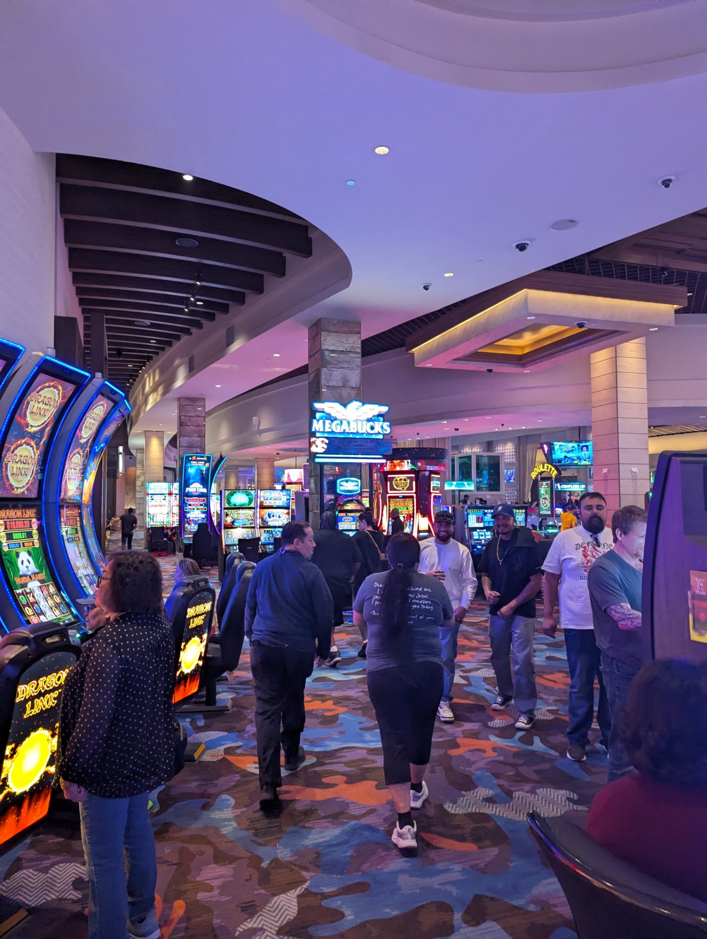 A casual walk through a casino floor with slot machines and gaming areas. While not a structured workout, the continuous movement and walking activity counts as light cardio exercise.