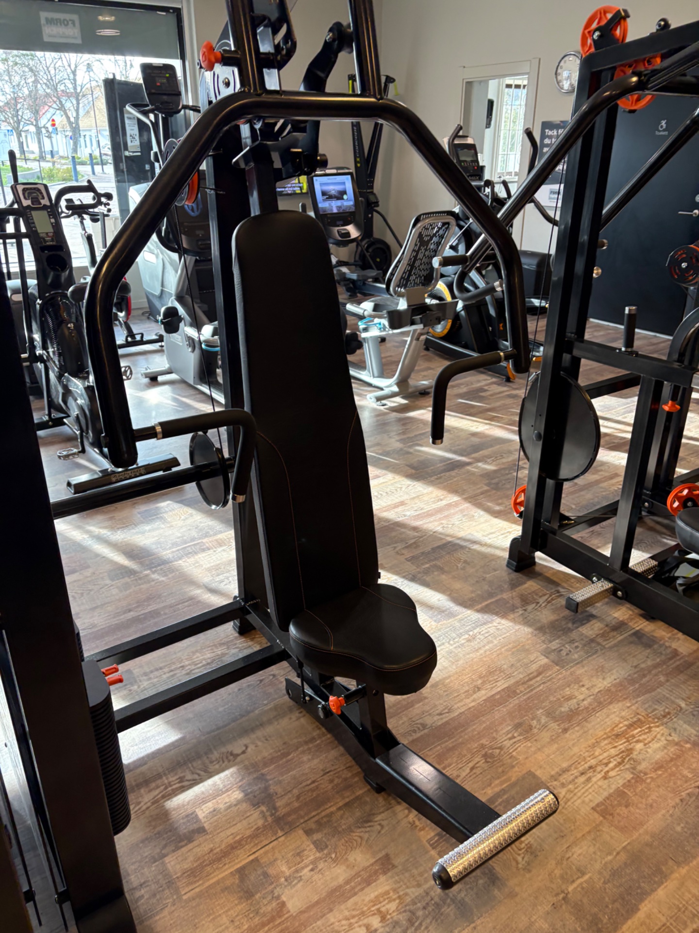 A gym setup showcasing multiple cardio machines including stationary bikes and elliptical equipment, ready for an intense cardio workout session!