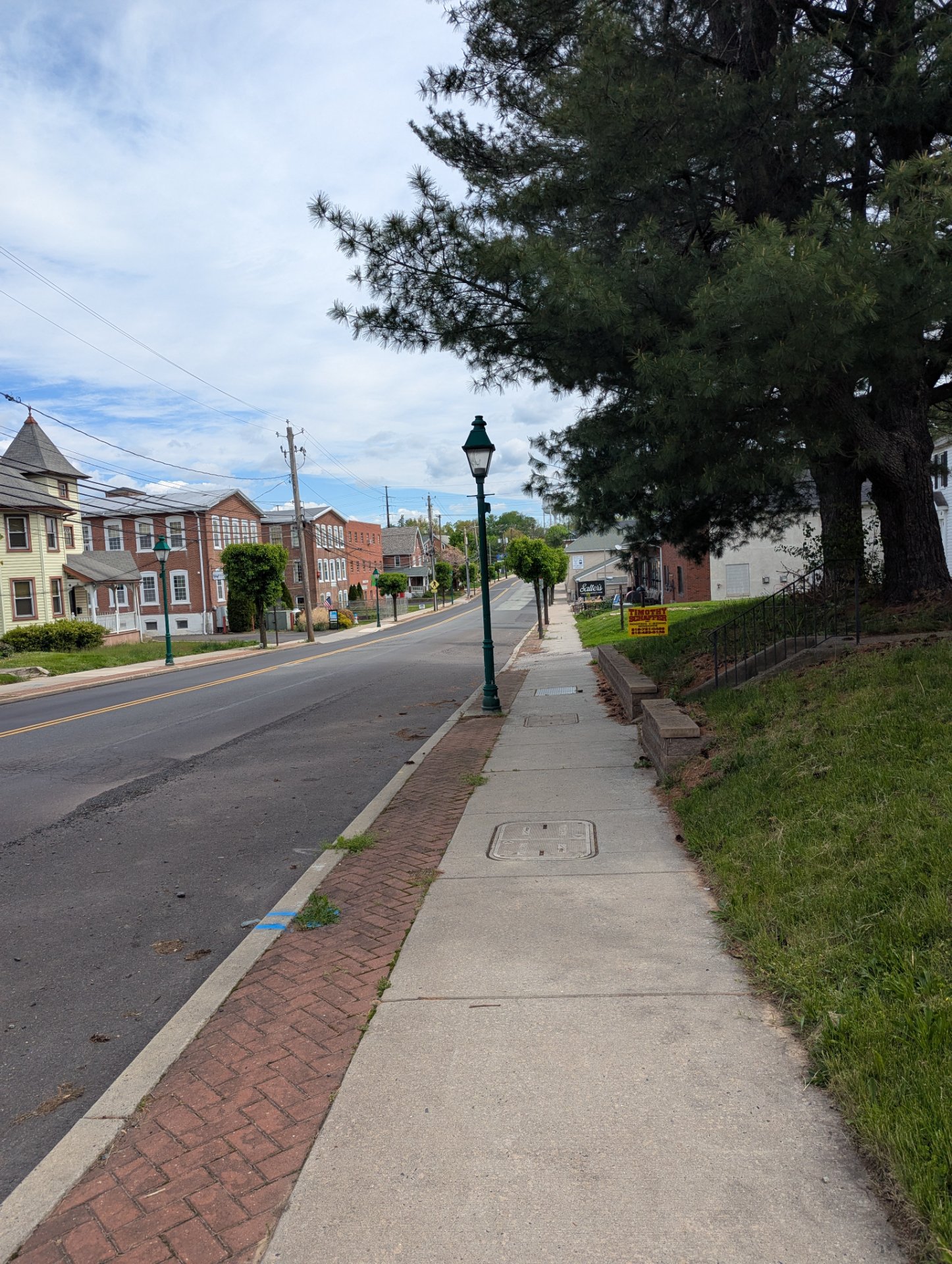 A scenic walk or run through a charming historic town street with tree-lined sidewalks and classic architecture. Perfect for outdoor cardio activity!