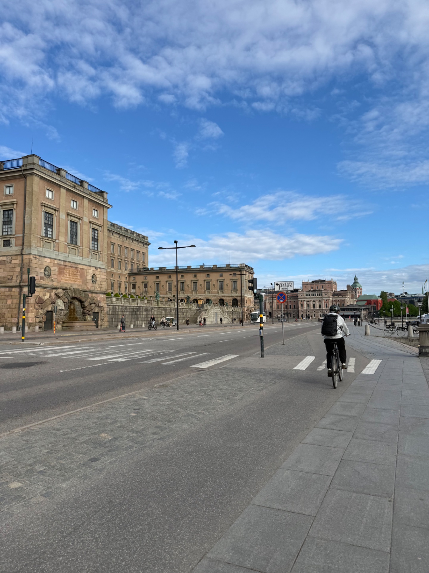 Urban cycling session through a historic city square! This rider is getting in some steady-state cardio on two wheels with beautiful architecture as the backdrop.
