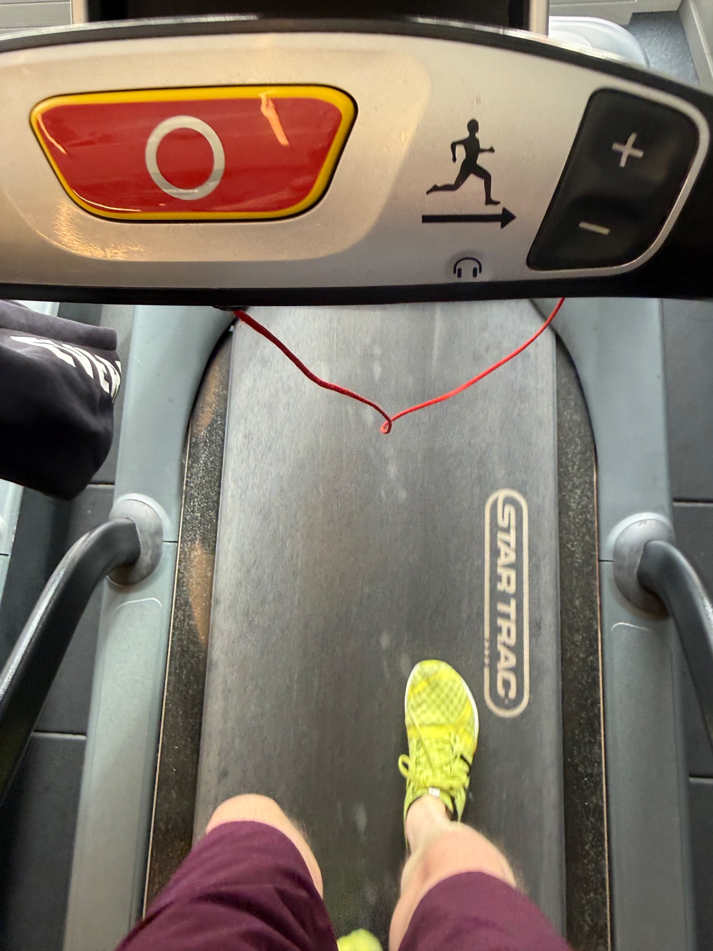Treadmill running workout! The photo shows someone running on a treadmill with bright neon running shoes, ready to crush a cardio session.