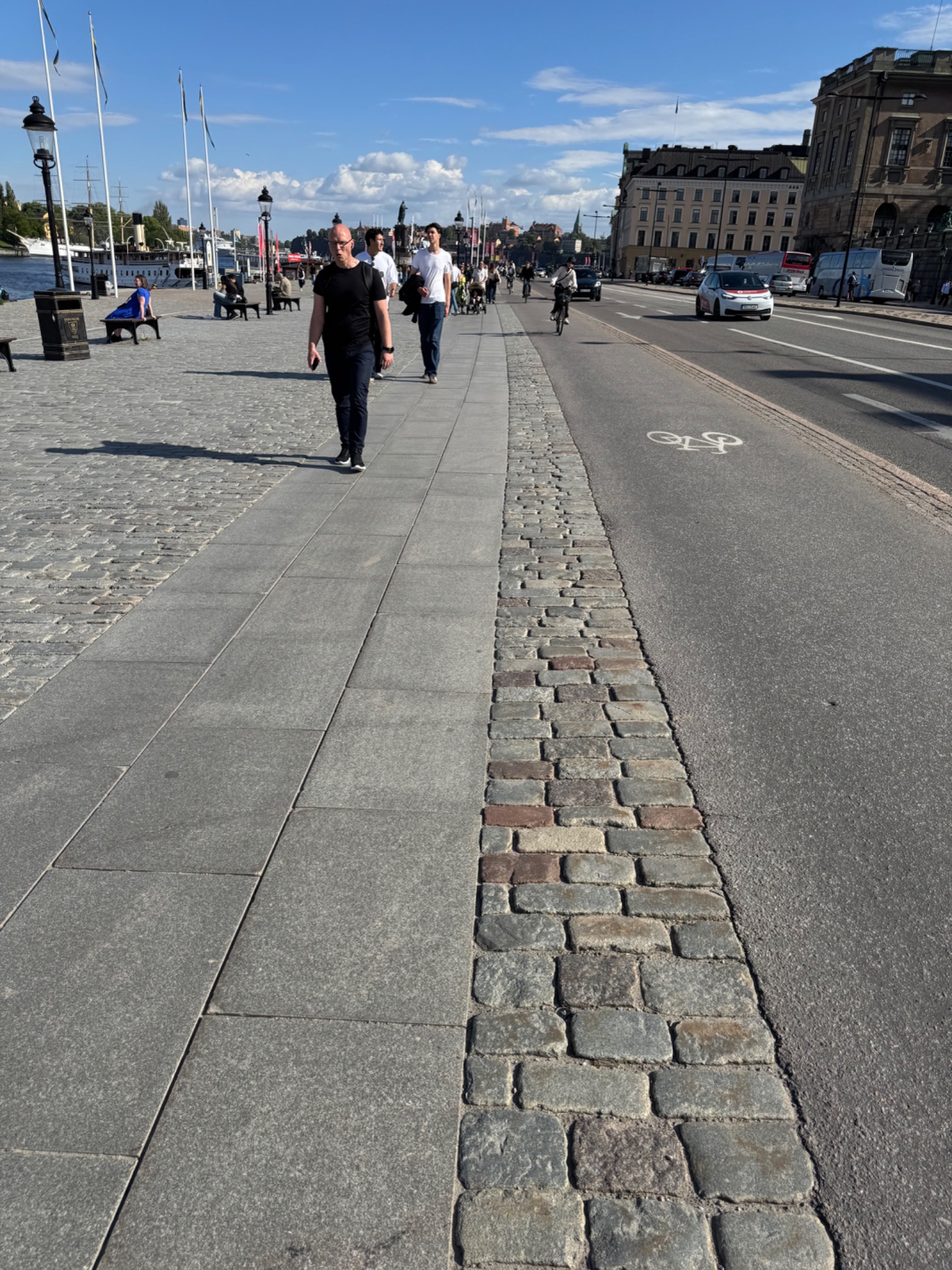 A scenic outdoor walk or light jog through a beautiful waterfront plaza in what appears to be a European city. Great way to get steps in while enjoying fresh air and urban scenery!