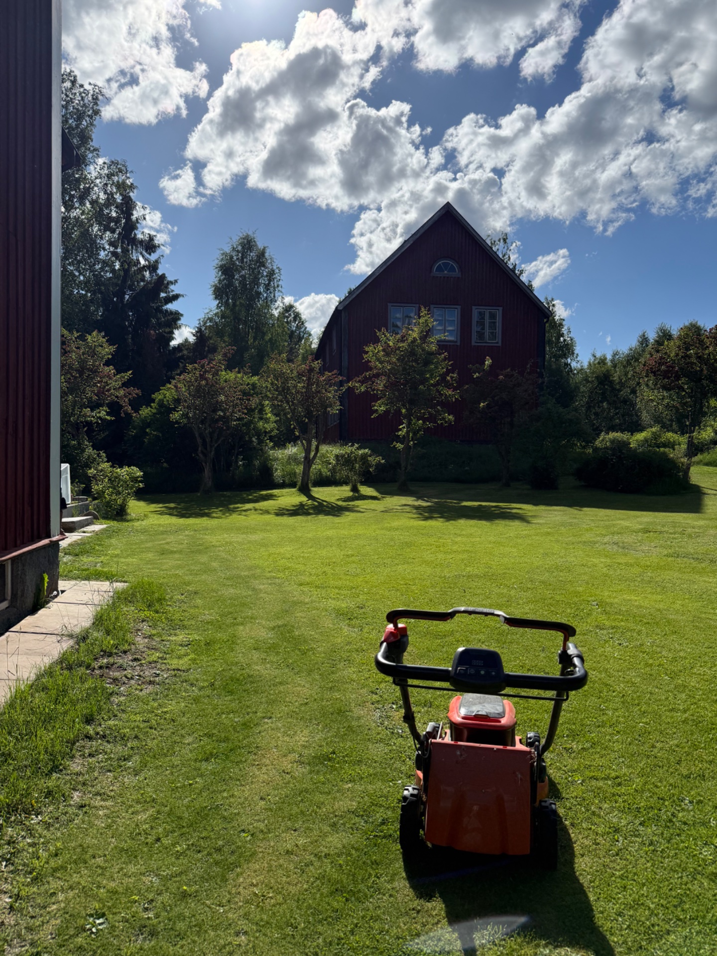 A beautiful outdoor cardio session pushing a stroller across a scenic grassy lawn! This active outdoor workout combines cardiovascular exercise with the added resistance of pushing a loaded stroller through the yard.