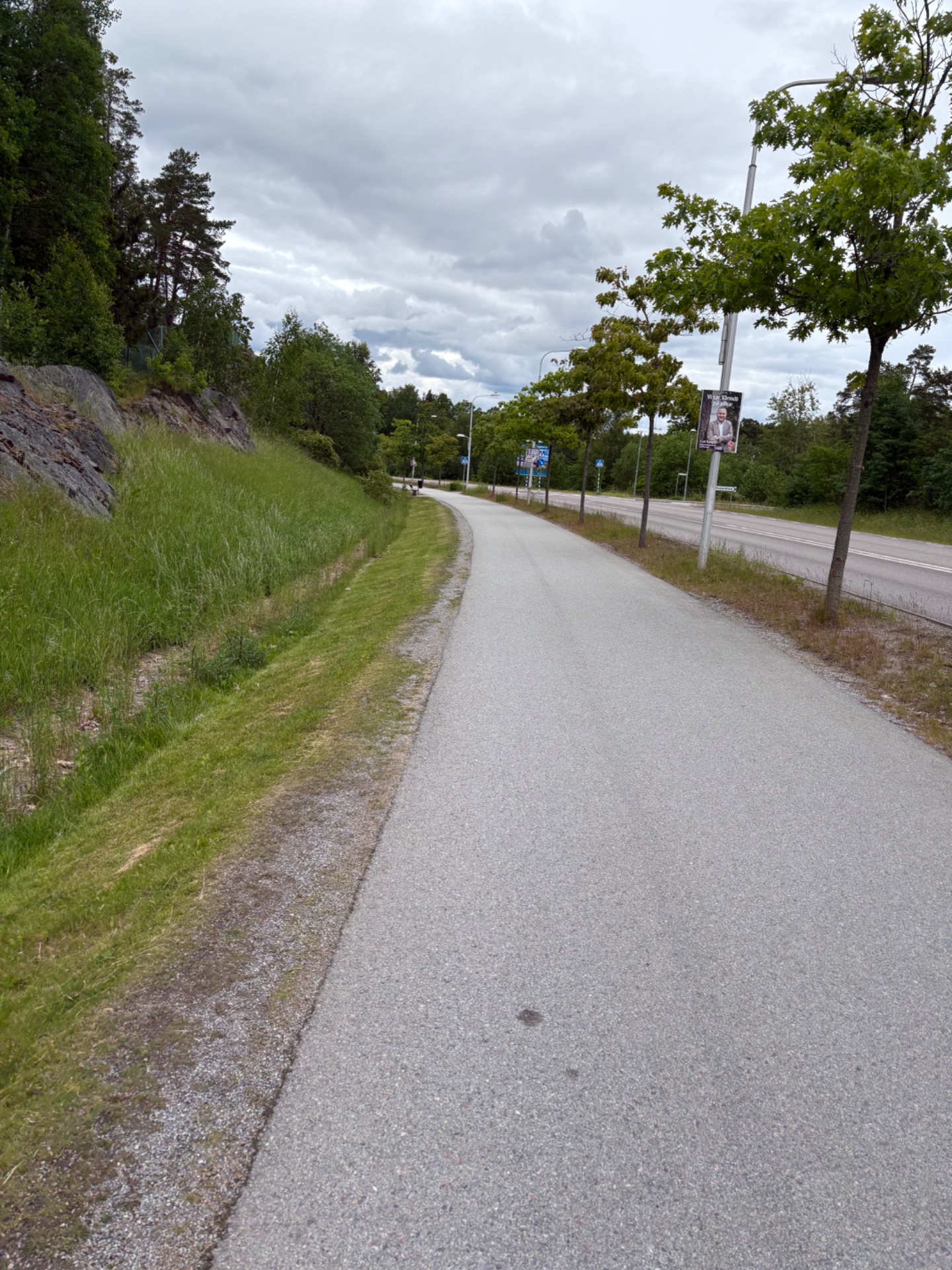 A scenic outdoor path perfect for running, walking, or cycling! This well-maintained trail through a green landscape offers a great cardio workout with beautiful natural surroundings.