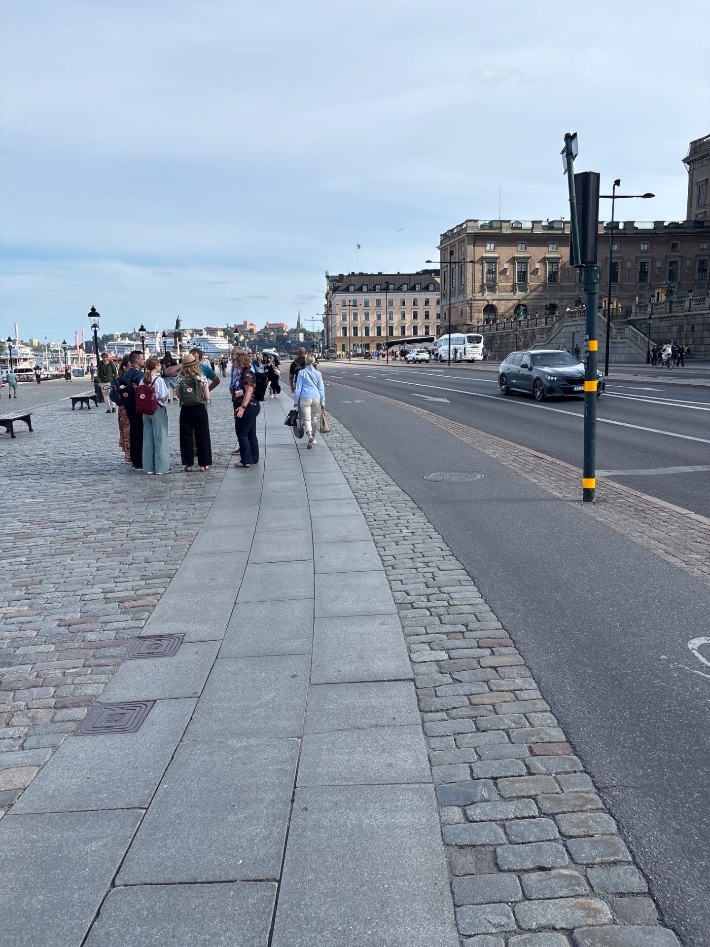 Urban walking workout through a scenic waterfront city area! This is a great low-impact cardio session exploring the streets and plazas of what appears to be a European city.